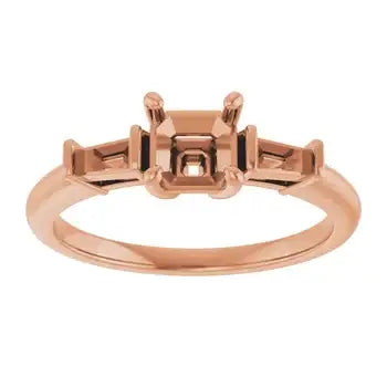 Rose gold engagement ring setting with square center stone mount and rectangular side stone settings.