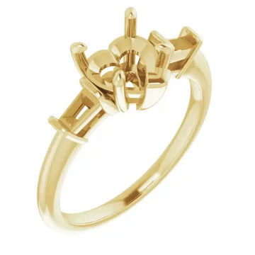 Gold engagement ring setting with geometric heart-shaped stone holder and tapered band.