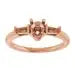 Rose gold engagement ring setting with pear-shaped center stone and accent diamonds on band.