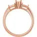 Rose gold engagement ring setting with three pear-shaped stone seats and decorative side details.