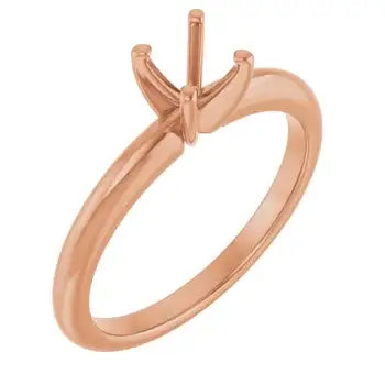 Rose gold solitaire engagement ring setting with four-prong head for round stone.