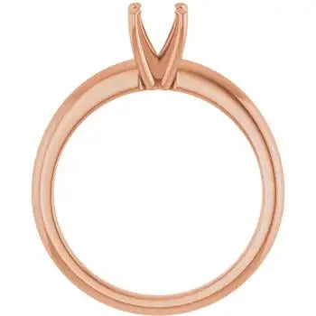Rose gold solitaire engagement ring setting with V-shaped prongs for round stone, shown from above.