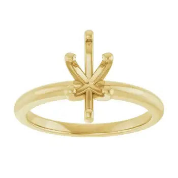 Gold solitaire engagement ring setting with empty marquise stone holder and decorative prongs.