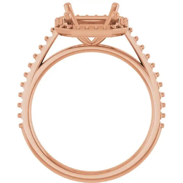 Rose gold engagement ring setting with four-prong halo design and pavé diamonds around the band, shown without center stone.