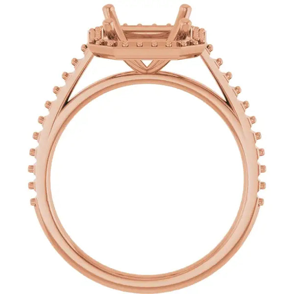 Rose gold engagement ring setting with four-prong halo design and pavé diamonds around the band, shown without center stone.