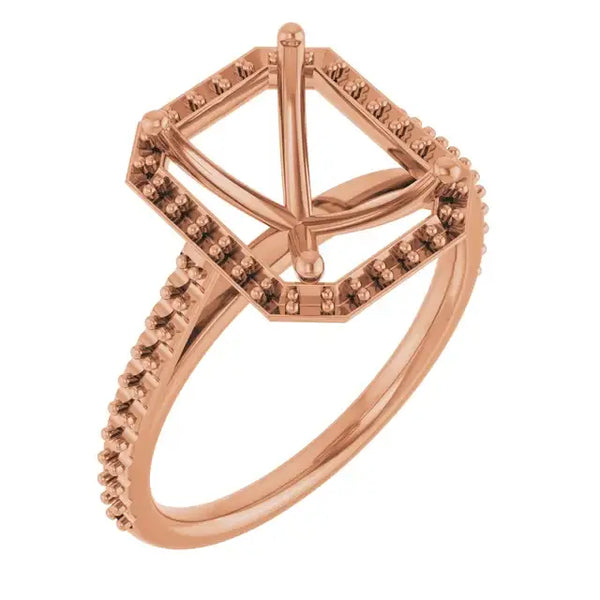 Rose gold engagement ring setting with halo design, pavé-set stones on band, and four-prong center stone holder.
