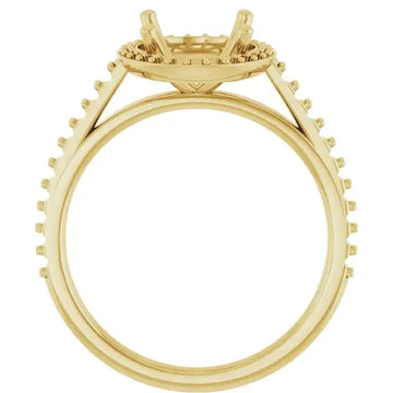 Gold engagement ring setting with halo design, four prongs, and pavé diamonds along the band.
