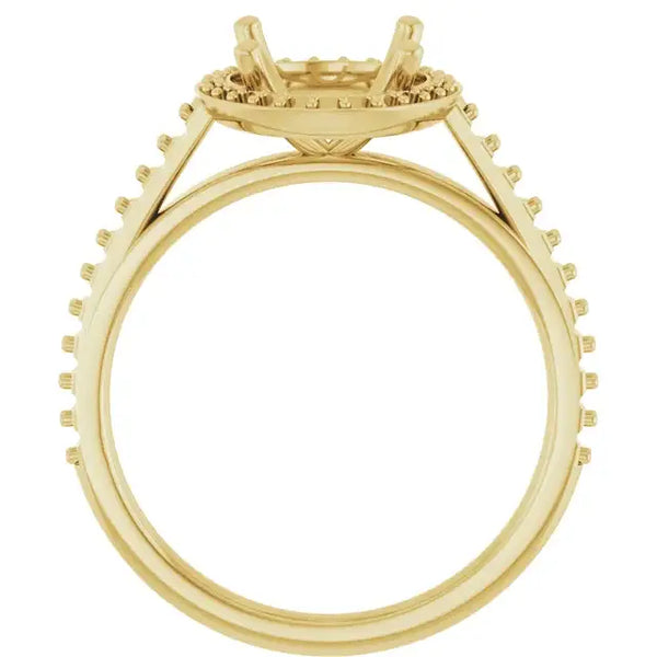 Gold engagement ring setting with halo design, four prongs, and pavé diamonds along the band.