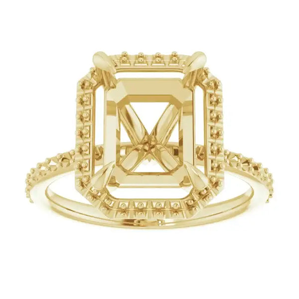 Gold engagement ring setting with halo and side stones in emerald-cut design, shown from front view.