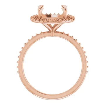 Rose gold engagement ring setting with halo design and pave detailing, shown without center stone.