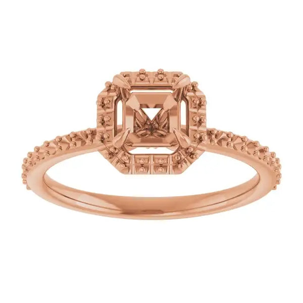 Rose gold halo engagement ring setting with asscher-cut stone center and decorative beaded band.