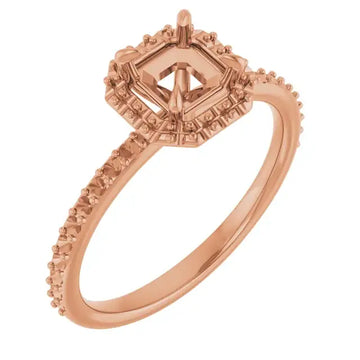 Rose gold engagement ring setting with asscher-cut stone head, decorative halo, and accent stones along the band.