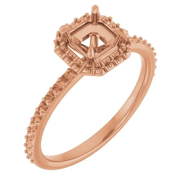 Rose gold engagement ring setting with asscher-cut stone head, decorative halo, and accent stones along the band.