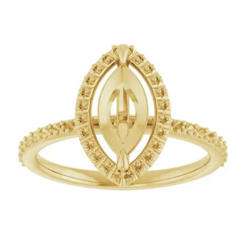 Yellow gold halo engagement ring setting with marquise-shaped center stone and small accent diamonds on band.