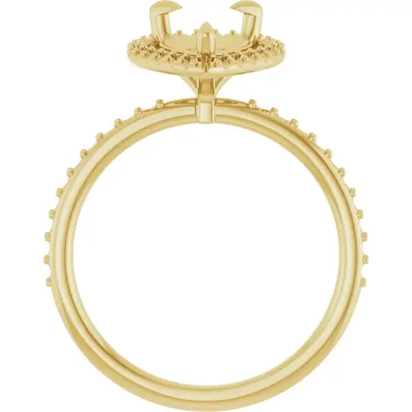 Gold engagement ring setting with halo crown and studded band designed for pear-shaped stones.