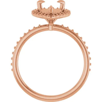 Rose gold engagement ring setting with halo design and small round stone accents around band and top.