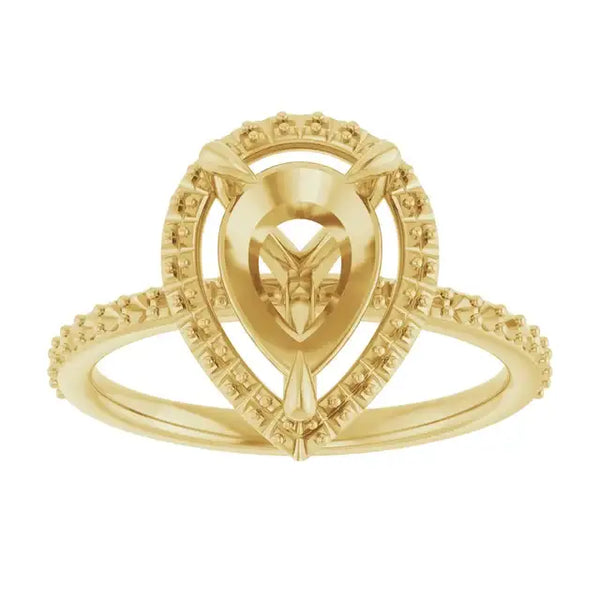 Yellow gold engagement ring setting with pear-shaped center stone and halo of small diamonds.