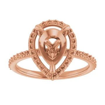 Rose gold engagement ring setting with pear-shaped stone center, halo surround, and detailed band design.