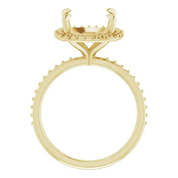 Gold engagement ring setting with cushion-cut stone holder featuring halo design and textured band.