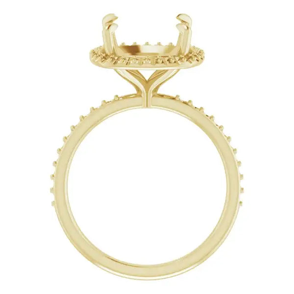 Gold engagement ring setting with cushion-cut stone holder featuring halo design and textured band.