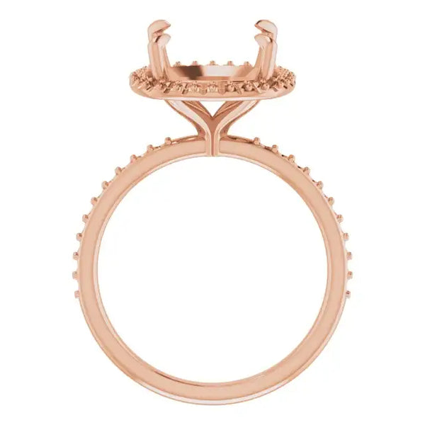 Rose gold ring setting with cushion-cut stone holder featuring halo design and textured band.