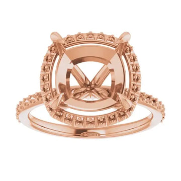 Rose gold halo engagement ring setting with cushion-shaped center stone mounting and decorative side accents.