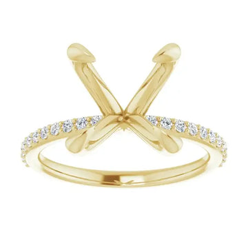 Gold engagement ring setting with crossed prongs and diamond-studded band for oval stones.