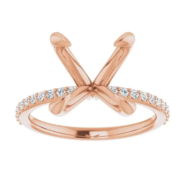 Rose gold engagement ring setting with crossed prongs for oval stones and diamond-accented band.