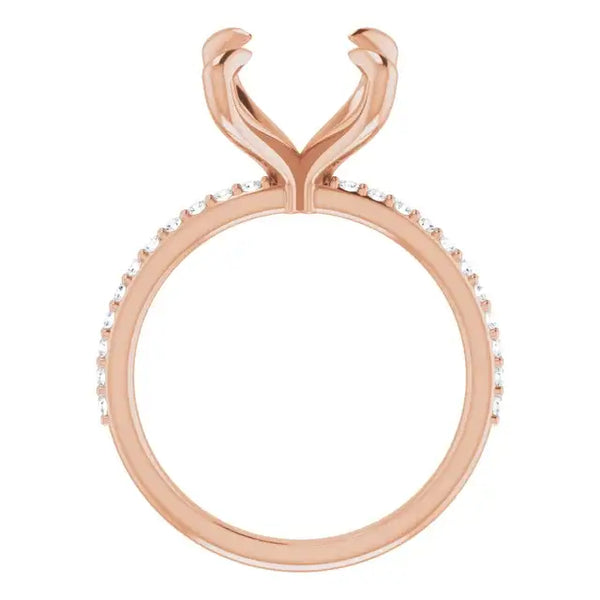 Rose gold engagement ring setting with curved prongs and diamond-accented band, designed for oval stones.