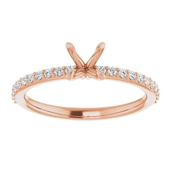 Rose gold engagement ring setting with V-shaped prongs and diamond accent stones along the band.