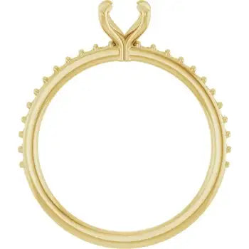 Gold engagement ring setting with round stone prongs and textured diamond-shaped accents around the band.