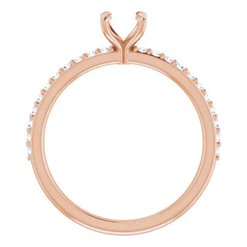 Rose gold engagement ring setting with V-shaped prongs and small diamonds along the band.
