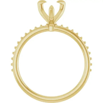 Yellow gold ring setting with pear-shaped stone holder and small round prong accents along the band.