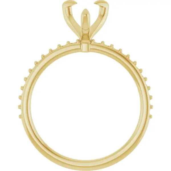 Yellow gold ring setting with pear-shaped stone holder and small round prong accents along the band.