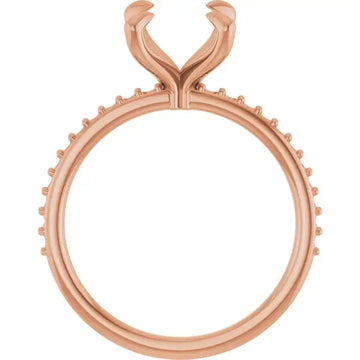 Rose gold engagement ring setting with oval stone seat and decorative split prong head.