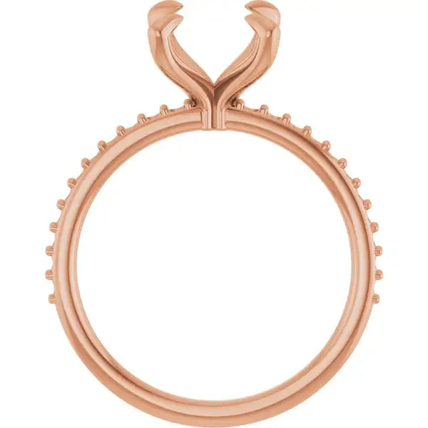 Rose gold engagement ring setting with oval stone seat and decorative split prong head.
