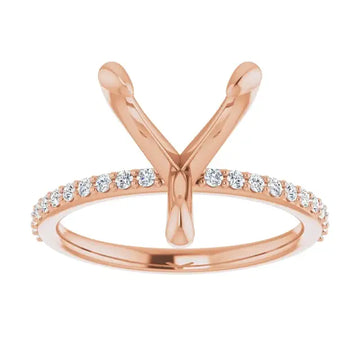 Rose gold engagement ring setting with V-shaped prongs and round diamonds set along the band.