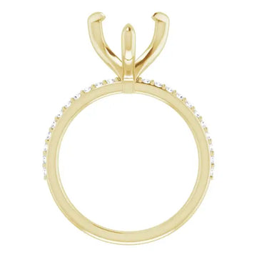 Gold engagement ring setting with V-shaped prongs and diamond accents along the band.