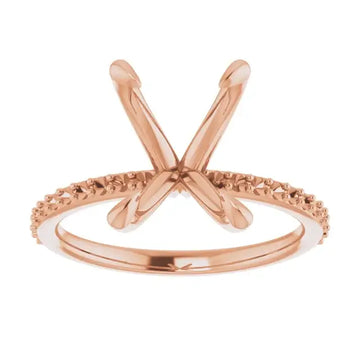 Rose gold engagement ring setting with X-shaped prongs and textured band for square stones.