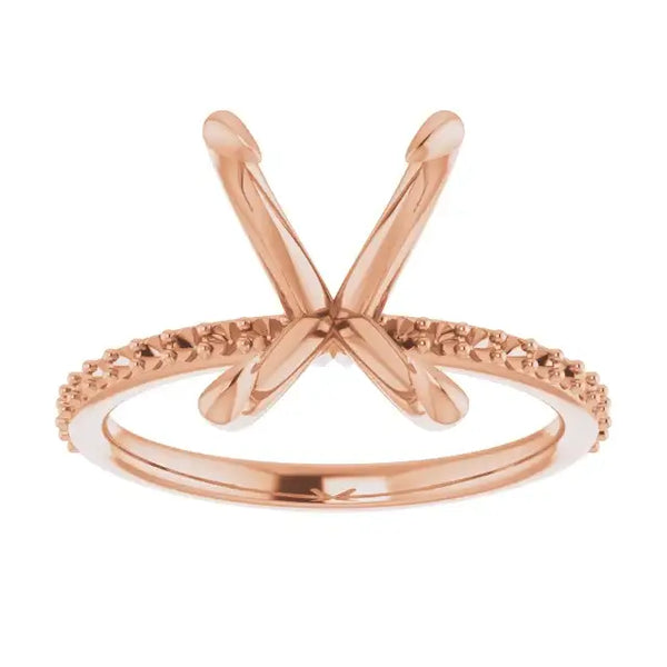 Rose gold engagement ring setting with X-shaped prongs and textured band for square stones.