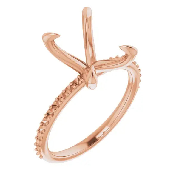 Rose gold engagement ring setting with curved prongs and pave-set stones along the band.