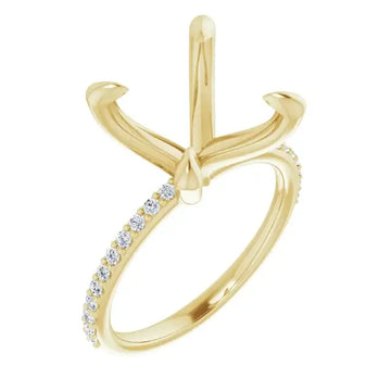 Yellow gold engagement ring setting with four-prong head and diamond-accented band.