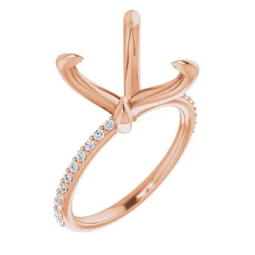 Rose gold engagement ring setting with four-prong cushion stone holder and diamond-accented band.