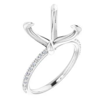 White metal engagement ring setting with four-prong head and diamond-accented band.