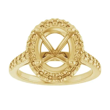 Gold engagement ring setting with ornate beaded halo and scrollwork accents for oval stones.