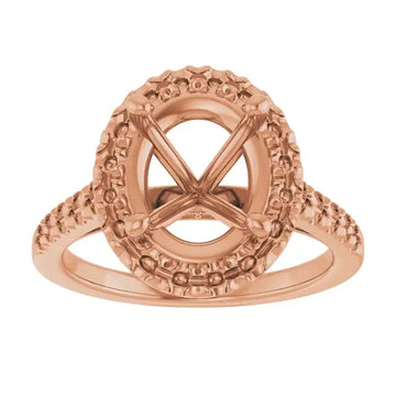 Rose gold engagement ring setting with ornate beaded halo frame for oval stones.