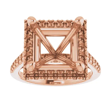 Rose gold engagement ring setting with square stone holder, decorative beaded halo, and textured band.