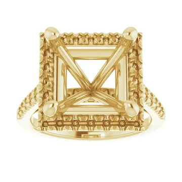 Gold engagement ring setting with square stone holder, decorative border detailing, and accent stones at corners.