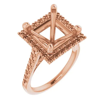 Rose gold engagement ring setting with square cushion-cut stone holder and textured diamond-shaped halo frame.