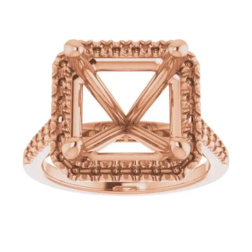 Rose gold ring setting with ornate square halo and X-cross center design for asscher-cut stones.
